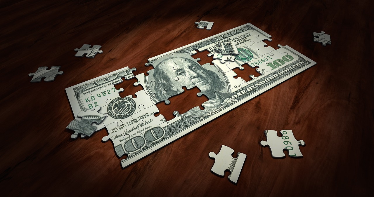 Graphic of a One Hundred Dollar Bill depicted as a puzzle.